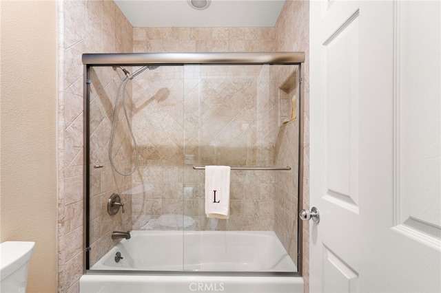 14067 Glendale Ct, Rancho Cucamonga, CA 91739 - bathroom with bath / shower combo with glass door and toilet