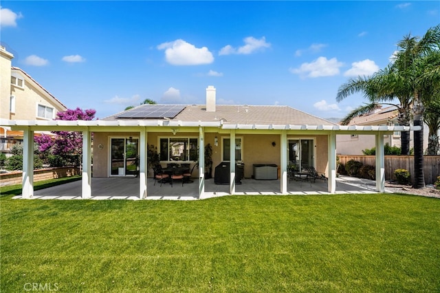 14067 Glendale Ct, Rancho Cucamonga, CA 91739 - rear view of property featuring solar panels, a patio area, stucco siding, and a chimney