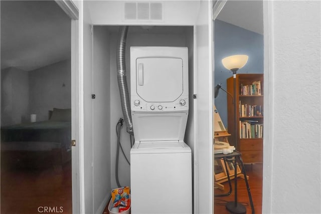 259 N Holliston Ave Unit 1, Pasadena, CA 91106 - washroom with stacked washer / dryer and wood finished floors