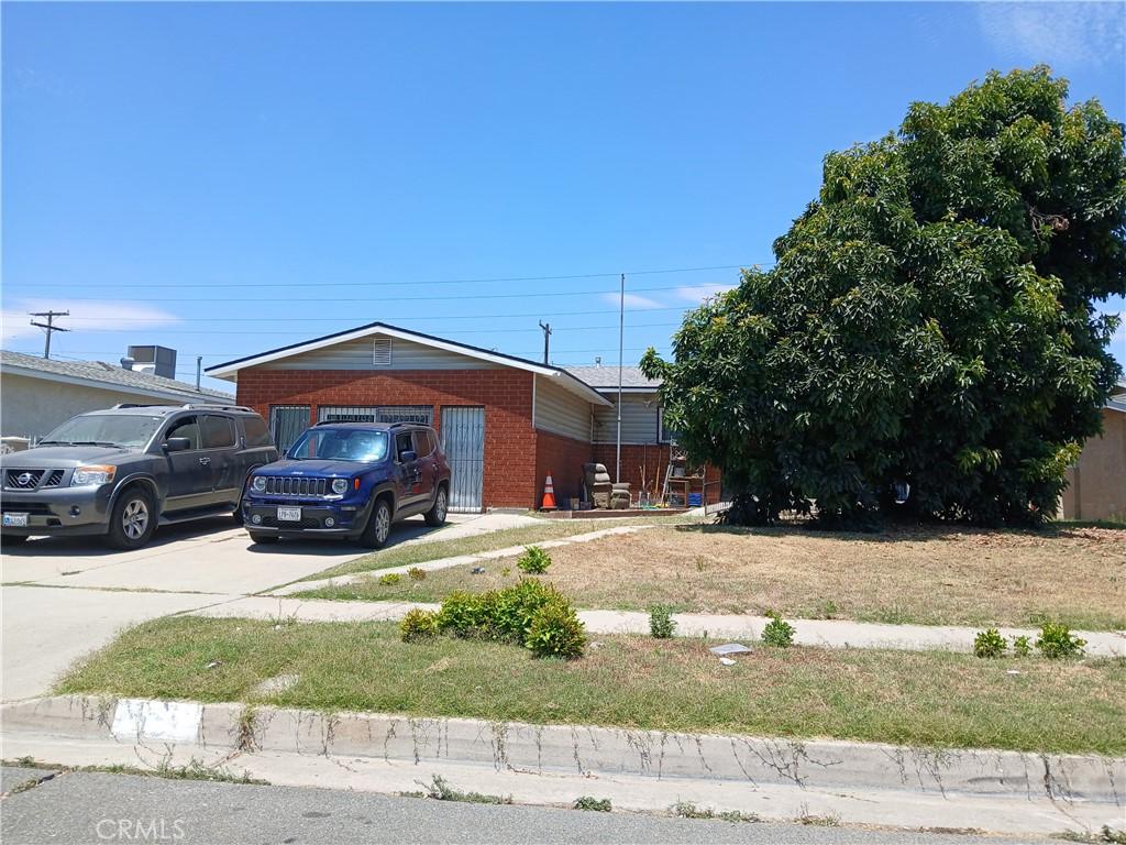 451 Walters St, Colton, CA 92324 - view of front of home featuring brick siding and driveway