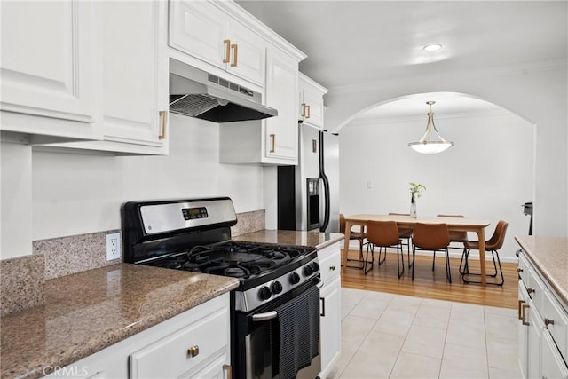 569 S Fenimore Ave, Covina, CA 91723 - kitchen with stainless steel appliances, under cabinet range hood, arched walkways, crown molding, and white cabinets