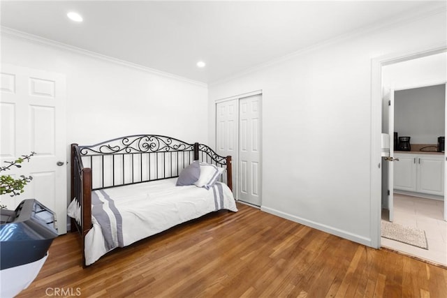 569 S Fenimore Ave, Covina, CA 91723 - bedroom featuring ornamental molding, wood finished floors, recessed lighting, and a closet