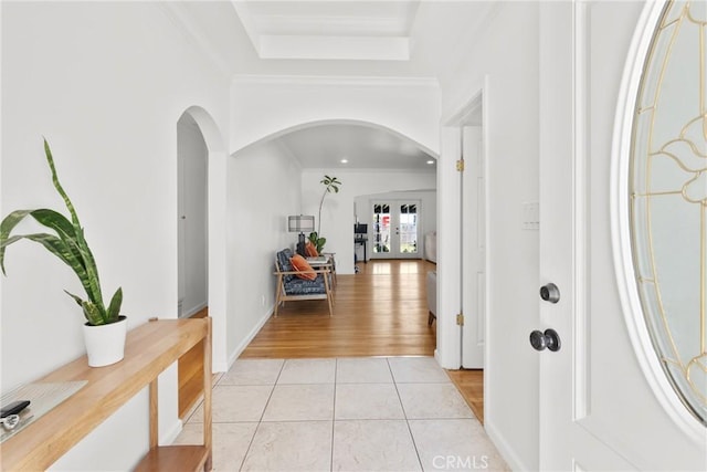 569 S Fenimore Ave, Covina, CA 91723 - entryway with arched walkways, crown molding, and light tile patterned floors