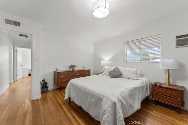 569 S Fenimore Ave, Covina, CA 91723 - bedroom with light wood-style flooring and crown molding