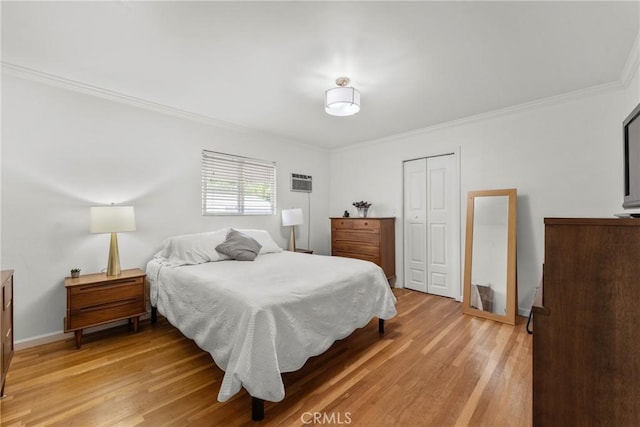 569 S Fenimore Ave, Covina, CA 91723 - bedroom with light wood-style flooring, a closet, and ornamental molding