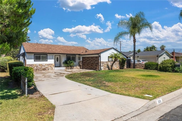 569 S Fenimore Ave, Covina, CA 91723 - ranch-style home featuring stone siding, a garage, driveway, and a front lawn
