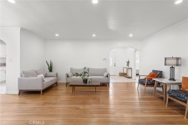 569 S Fenimore Ave, Covina, CA 91723 - living room with arched walkways, crown molding, recessed lighting, and light wood finished floors