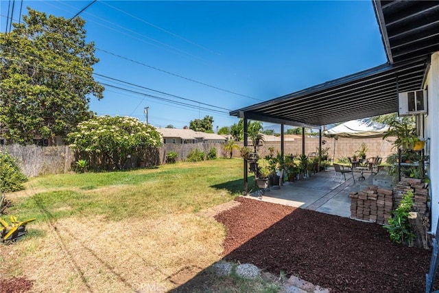 569 S Fenimore Ave, Covina, CA 91723 - fenced backyard featuring a patio area and a wall unit AC