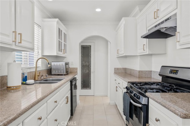 569 S Fenimore Ave, Covina, CA 91723 - kitchen featuring stainless steel gas stove, under cabinet range hood, dishwashing machine, white cabinetry, and ornamental molding