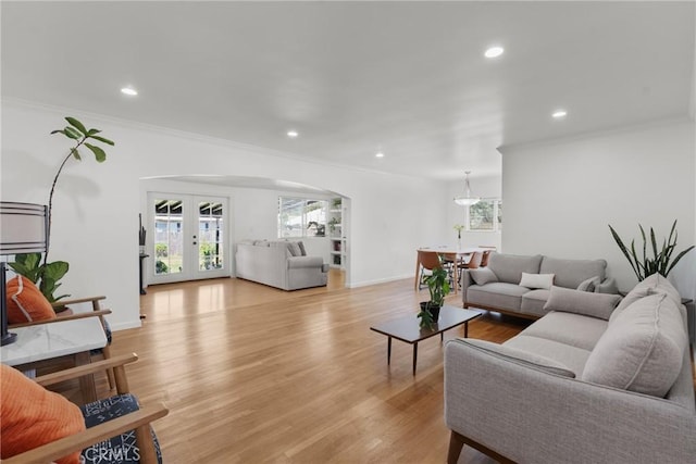 569 S Fenimore Ave, Covina, CA 91723 - living room with recessed lighting, plenty of natural light, arched walkways, ornamental molding, and light wood-style flooring