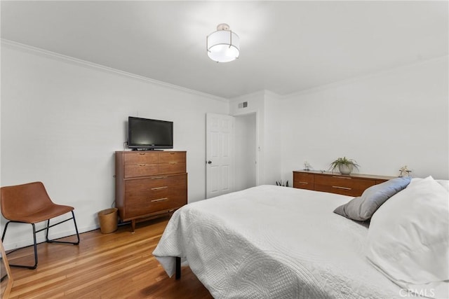 569 S Fenimore Ave, Covina, CA 91723 - bedroom with crown molding and wood finished floors
