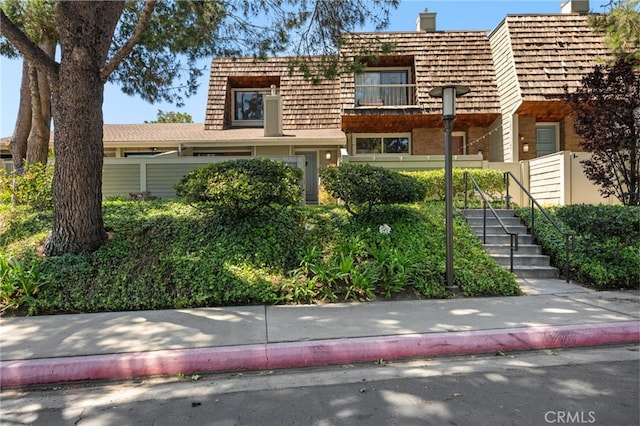 4320 Glencoe Ave Unit 2, Marina Del Rey, CA 90292 - view of front of home with stairs, mansard roof, and a chimney