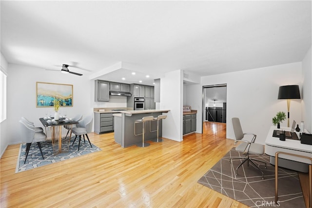 4320 Glencoe Ave Unit 2, Marina Del Rey, CA 90292 - living room with light wood finished floors, ceiling fan, and recessed lighting