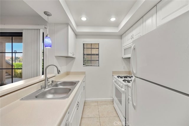 1068 Calle Del Cerro Unit 1521, San Clemente, CA 92672 - kitchen with white appliances, light tile patterned flooring, light countertops, white cabinets, and hanging light fixtures