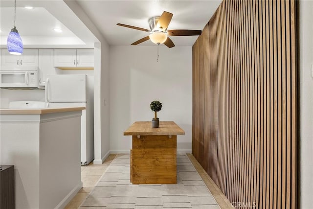 1068 Calle Del Cerro Unit 1521, San Clemente, CA 92672 - kitchen featuring white appliances, a ceiling fan, recessed lighting, white cabinets, and hanging light fixtures