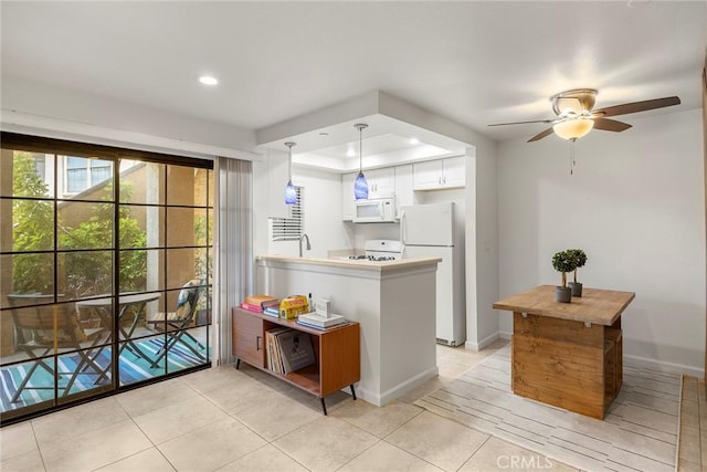 1068 Calle Del Cerro Unit 1521, San Clemente, CA 92672 - kitchen featuring white appliances, light tile patterned flooring, ceiling fan, recessed lighting, and a peninsula