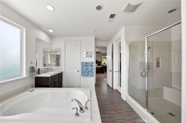 982 Camino Del Arroyo Dr Unit 49, San Marcos, CA 92078 - full bath featuring vanity, a garden tub, a stall shower, french doors, and recessed lighting