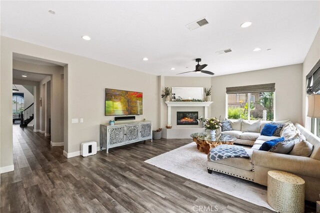 982 Camino Del Arroyo Dr Unit 49, San Marcos, CA 92078 - living room with a ceiling fan, wood finished floors, a glass covered fireplace, recessed lighting, and stairway
