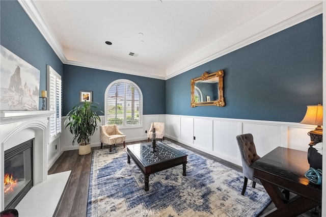 982 Camino Del Arroyo Dr Unit 49, San Marcos, CA 92078 - living area with wood finished floors, a glass covered fireplace, crown molding, and wainscoting