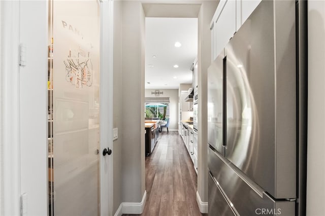 982 Camino Del Arroyo Dr Unit 49, San Marcos, CA 92078 - hallway with wood finished floors and recessed lighting
