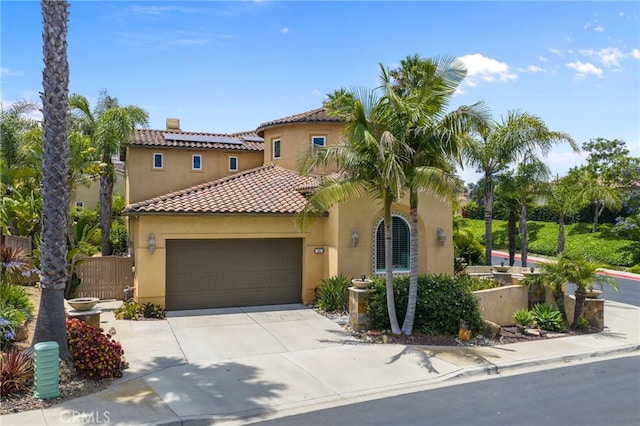 982 Camino Del Arroyo Dr Unit 49, San Marcos, CA 92078 - mediterranean / spanish home featuring stucco siding, concrete driveway, a tile roof, and a garage