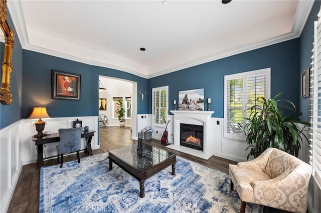 982 Camino Del Arroyo Dr Unit 49, San Marcos, CA 92078 - living area with a wainscoted wall, wood finished floors, crown molding, and a glass covered fireplace