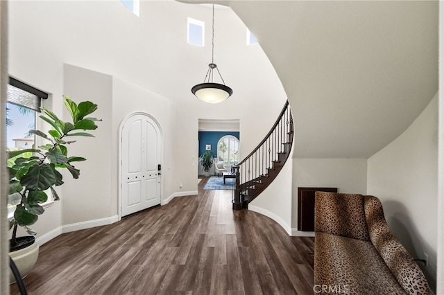 982 Camino Del Arroyo Dr Unit 49, San Marcos, CA 92078 - entrance foyer with a towering ceiling, healthy amount of natural light, dark wood-style floors, and stairs