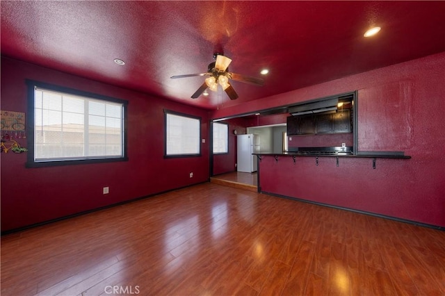 8933 Locust Ave, Fontana, CA 92335 - unfurnished living room with a ceiling fan, wood finished floors, and recessed lighting