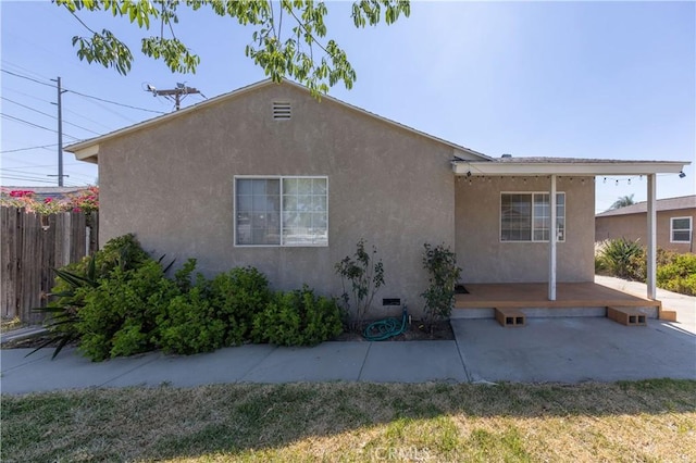 8933 Locust Ave, Fontana, CA 92335 - view of property exterior featuring a patio and stucco siding