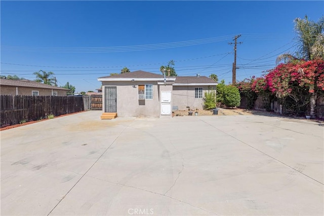 8933 Locust Ave, Fontana, CA 92335 - back of house with stucco siding and a patio