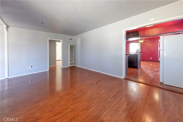 8933 Locust Ave, Fontana, CA 92335 - spare room with wood finished floors and ceiling fan