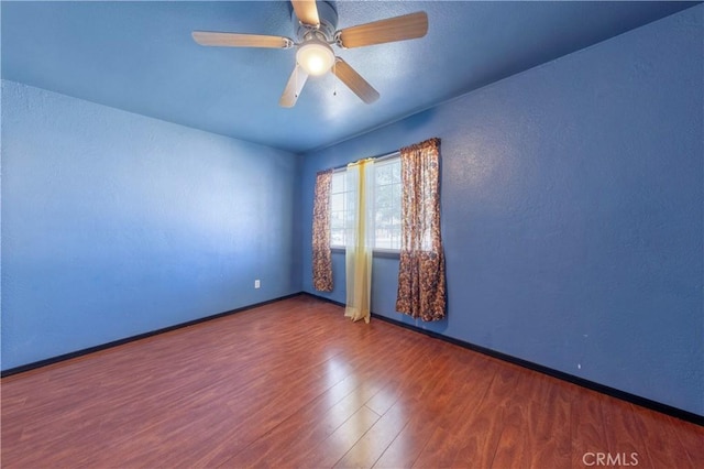 8933 Locust Ave, Fontana, CA 92335 - empty room with wood finished floors and a ceiling fan