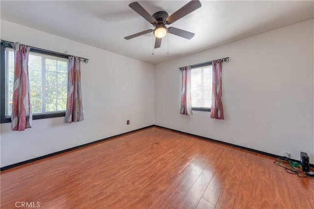 8933 Locust Ave, Fontana, CA 92335 - unfurnished room with plenty of natural light, wood finished floors, and a ceiling fan