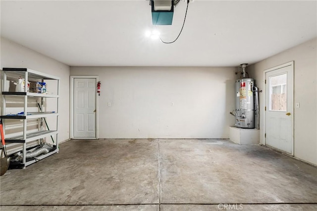 1057 Windsor Way, Chico, CA 95926 - garage with strapped water heater and a garage door opener