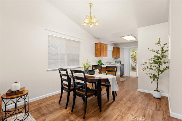 1057 Windsor Way, Chico, CA 95926 - dining room featuring a chandelier, light wood-style floors, and lofted ceiling