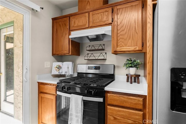 1057 Windsor Way, Chico, CA 95926 - kitchen with appliances with stainless steel finishes, under cabinet range hood, light countertops, and brown cabinetry