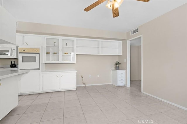 28980 Del Monte Dr, Menifee, CA 92586 - kitchen featuring white appliances, a ceiling fan, white cabinetry, light tile patterned floors, and light countertops