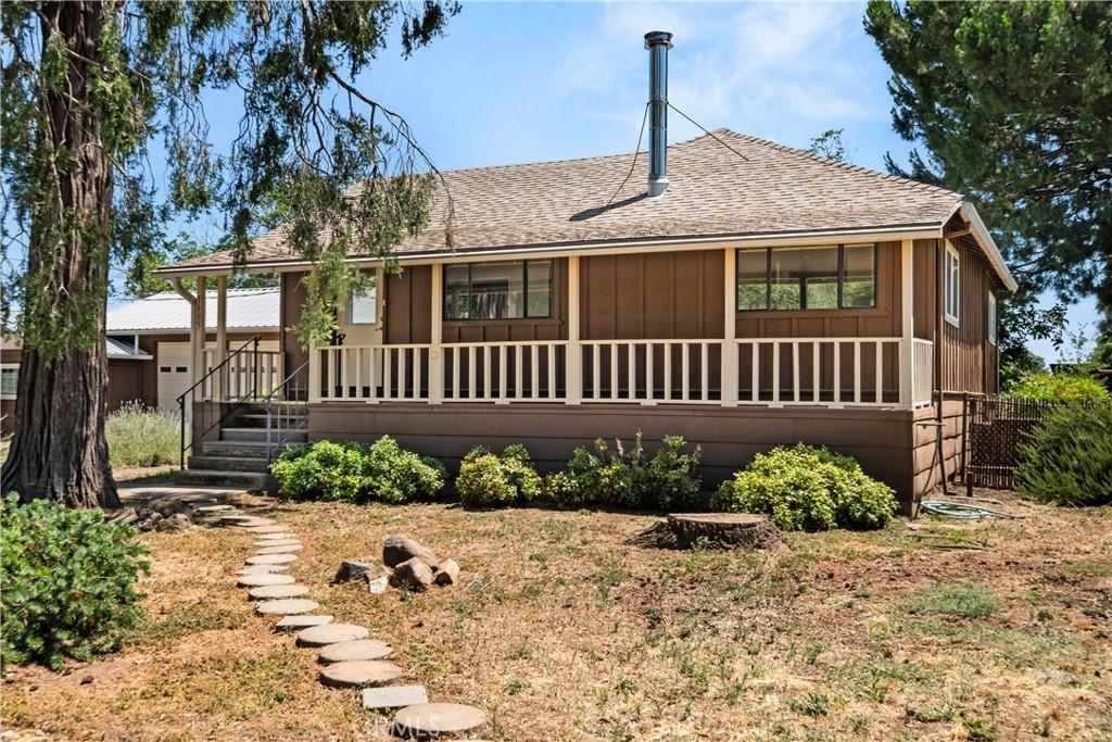 1605 Diamond Ave, Chico, CA 95928 - back of property featuring a shingled roof and board and batten siding