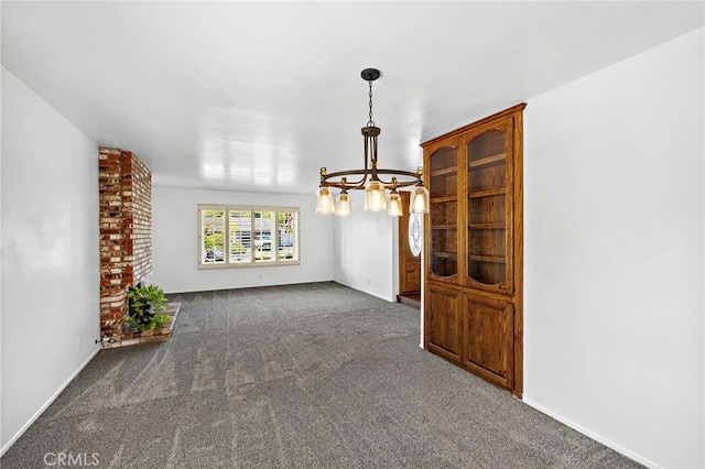 24802 La Plata Dr, Laguna Niguel, CA 92677 - empty room with a chandelier and dark colored carpet