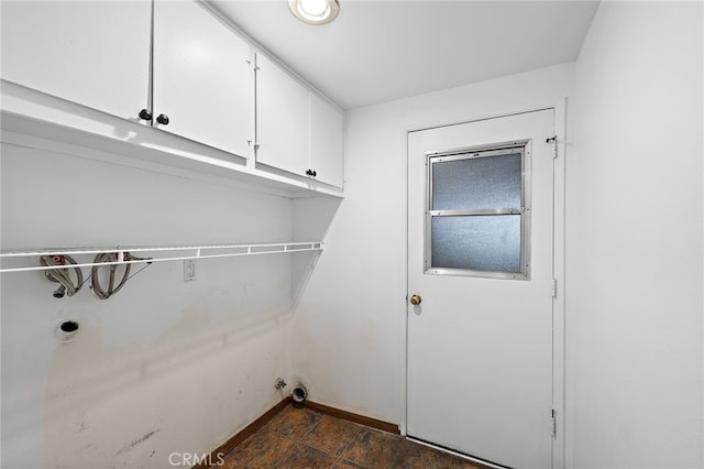 24802 La Plata Dr, Laguna Niguel, CA 92677 - washroom with cabinet space and dark stone finish flooring