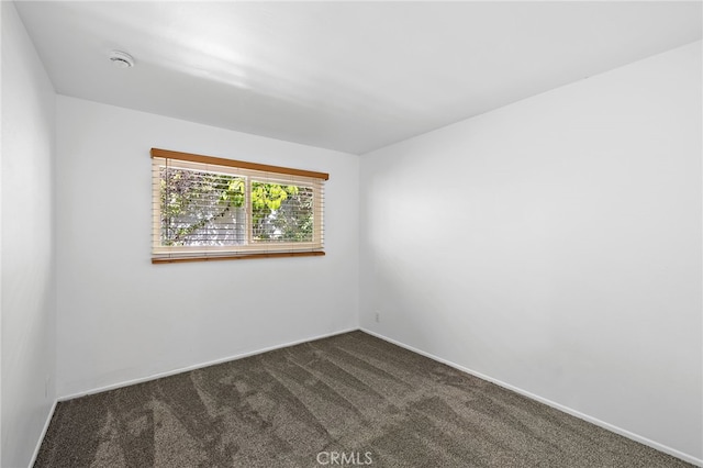 24802 La Plata Dr, Laguna Niguel, CA 92677 - spare room with dark carpet and a smoke detector