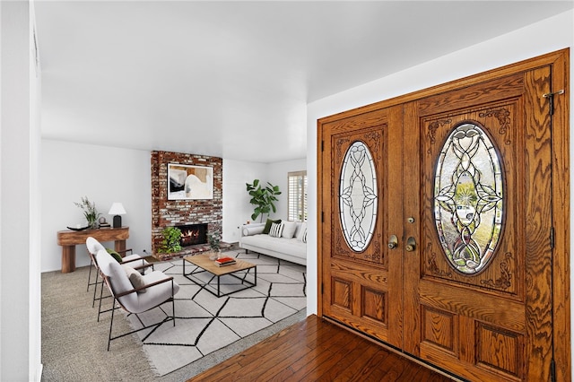 24802 La Plata Dr, Laguna Niguel, CA 92677 - foyer entrance featuring a brick fireplace and hardwood / wood-style floors