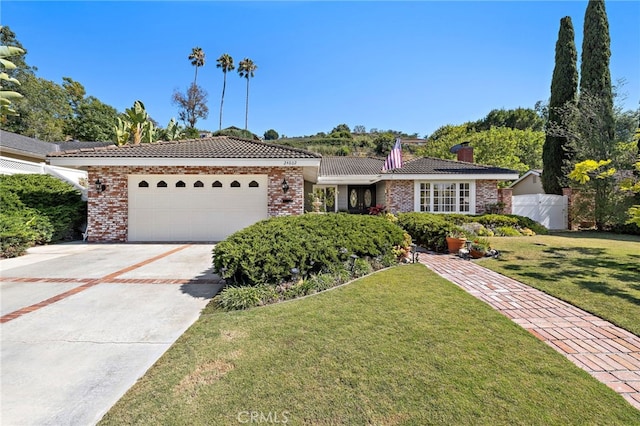 24802 La Plata Dr, Laguna Niguel, CA 92677 - single story home featuring a chimney, an attached garage, driveway, brick siding, and a tile roof