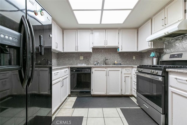 116 W Maple St Unit 25, Glendale, CA 91204 - kitchen with fridge with ice dispenser, stainless steel range with gas stovetop, black dishwasher, under cabinet range hood, and light tile patterned floors