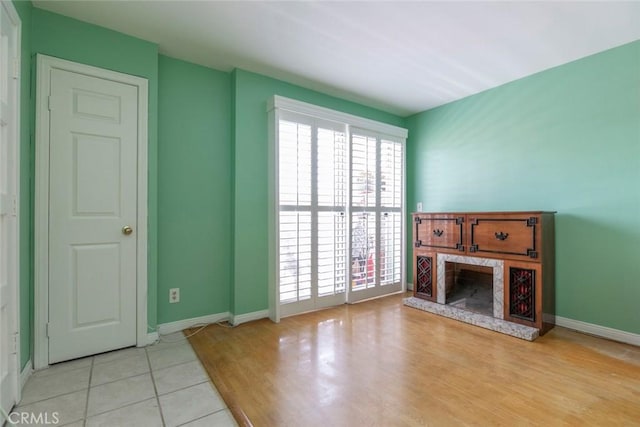 116 W Maple St Unit 25, Glendale, CA 91204 - unfurnished living room with a premium fireplace and wood finished floors