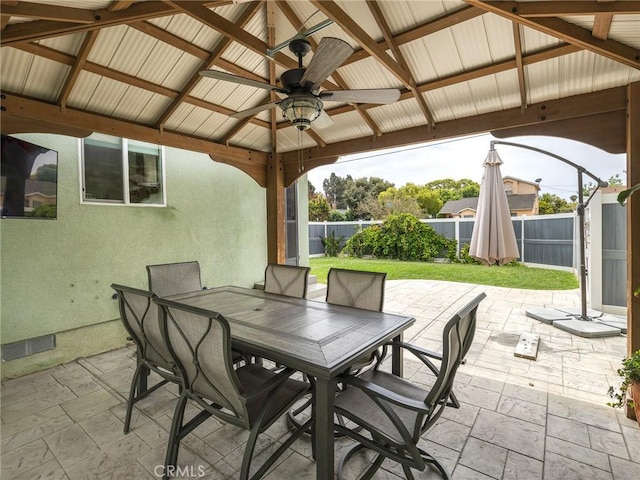 5243 E Monlaco Rd, Long Beach, CA 90808 - fenced backyard with outdoor dining area, ceiling fan, a gazebo, and a patio