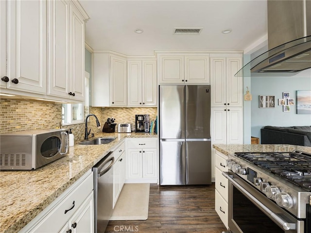 5243 E Monlaco Rd, Long Beach, CA 90808 - kitchen with appliances with stainless steel finishes, ventilation hood, dark wood-style floors, light stone counters, and white cabinets