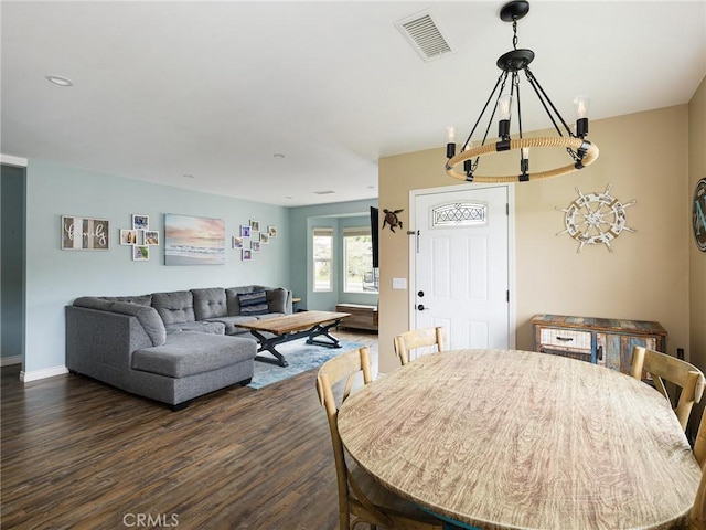5243 E Monlaco Rd, Long Beach, CA 90808 - dining space featuring a chandelier and dark wood finished floors