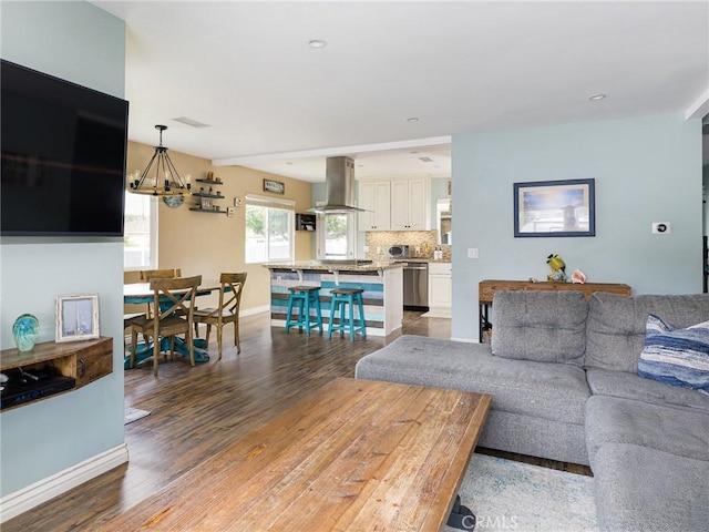 5243 E Monlaco Rd, Long Beach, CA 90808 - living area with a chandelier, light wood-style floors, and recessed lighting