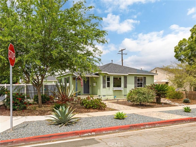 5243 E Monlaco Rd, Long Beach, CA 90808 - view of front facade featuring stucco siding and roof with shingles